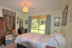  100 Balaclava St Balaclava NSW 2575 $868,000 JUST 3 MINUTES DRIVE TO MITTAGONG CENTRE IS THIS WELL PRESENTED FOUR BEDROOM HOME OFFERING A COMFORTABLE, RELAXED LIFESTYLE ON 1 1/4 ACRES GENEROUS, SUNNY, LIVING AREAS LEADING TO THE NORTH FACING GARDEN TERRACE * 4 bedrooms with robing * 2 modern bathrooms (ensuite to main) * Formal lounge with sliding French doors and dining with garden vistas * Well appointed kitchen with Ilve 5 burner cooker, stainless steel flue, Bosh dishwasher and an abundance of storage * Casual meals area adjacent to kitchen * Sunroom / family room with vaulted ceilings, under-floor heating, split-system air conditioning, slow combustion fire, skylight, sliding doors and bi-fold glass doors to terrace * Electric retractable awning over terrace * Ducted gas central heating * Bar-b-q area and terrace * Large shed / workshop (6m x 4m) * Tank + bore water for garden * Laundry with door to outside * Double garage with auto door * Zoning: R2 Low Residential - 700m2 minimum lot size * Landsize: 4904m2 SET BACK FROM THE ROAD ON AN ESTABLISHED 1 1/4 ACRES WITH NUMEROUS SPECIMEN AND FRUIT TREES THERE IS ALSO THE POSSIBILITY OF SUB-DIVIDING (S.T.C.A) AS THE ZONING IS MINIMUM LOT REQUIREMENT 700M2 ONLY A FEW MINUTES TO MITTAGONG CENTRE AND THE HUME MOTORWAY.. 