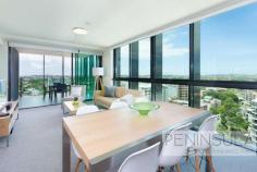  1310/18 Thorn Street Kangaroo Point QLD 4169 Stepping into this ultra-modern and sleek apartment is both inspiring and exciting with an abundance of natural light and panoramic views above the river; A total luxury without equivalent for position, outlook and lifestyle in a premium location. Situated on the top floor position to take advantage of these stunning vista, this corner apartment offers the best position in popular Peninsular Apartments. A very chic home extending a sophisticated yet relaxed lifestyle in the sought-after Riverside of Kangaroo Point. Flooded with natural light, a smart design reveals a generous open plan living and dining area expanding to a spacious balcony overlooking the river and the Story Bridge. Imagine entertaining with these views as a backdrop to your stunning home. Featuring a spacious en-suite, mirrored build-ins and study nook the main bedroom is nothing short of spectacular with a feeling of floating above the river, intended from the floor to ceiling picture windows. The well-appointed corner kitchen comes complete with stainless steel European appliances, sleek overhead cabinetry, ceramic cooktop and polished stone benchtops. Offered to the sale fully furnished and equipped this apartment is available for immediate occupancy, presenting an outstanding opportunity for a home buyer or a strong investment for the investor. Property Features: • 	 Stunning king size master bedroom overlooking the river and the Story Bridge • 	 Built in robe- study nook in master and en-suite • 	 Second bedroom has generous mirrored Built-ins • 	 Internal laundry • 	 Ducted air conditioning throughout • 	 Designer furniture package included in the sale • 	 Resort Style heated lap pool and well equipped Gymnasium • 	 Secure intercom building and great on-site management • 	 Low Body Corporate and rates • 	 Level lift access- ideal for downsizers The popular Peninsula Apartments is a short stroll to the Brisbane River, great restaurants, pubs and cafes, parks, Shafston College and schools; Transport is easy with Buses- City Cat and City Hopper terminals all walking distance. Kangaroo Point offers a fantastic lifestyle that is about to be even improved with the planned construction of a pedestrian bridge across the river to the Botanical Garden and Brisbane CBD Don't delay your inspection; Vendors are motivated to sell their investment property. FEATURES: • 	 Air Conditioning • 	 Built-In Wardrobes • 	 Close To Schools • 	 Close To Shops • 	 Close To Transport • 	 Garden.. 