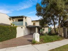  4/284 Mill Point Road South Perth WA 6151  $475,000 Combining convenience and an easy-care lifestyle in equal measures, this two-bedroom, brick and tile townhouse is just an 8-minute walk to the stunning South Perth foreshore, and only moments to local parks, cycle paths, shops, cafes, the iconic ‘Ciao Italia’ restaurant, and CBD-bound public transport routes (including the Mends Street ferry terminal and bus route). With space to park at least two vehicles and easy driveway access from Weston Avenue, this two-storey residence is part of an exclusive group of five dwellings, with recent improvements including the restoration of the tiled roof. Upon entering the property, there is an immediate sense of calm and warmth. The parquetry flooring, timber venetian blinds and kitchen cabinetry champion the distinctive features of the home. The open plan living and informal meals area adjoins a renovated kitchen equipped with a recently-replaced oven, 4-burner gas cooktop, tiled splashback, walk-in pantry, microwave hatch, twin sinks, overhead cupboards, and floating shelves. The ground floor also features a second W/C, separate laundry (with generous storage cupboard), gas bayonet, additional floating shelves, and an NBN connection. The sleeping accommodation is located on the first floor, with the master bedroom featuring a walk-in robe, venetian blinds and curtains, and reverse-cycle air conditioning. The minor bedroom also offers full window treatments, plus a built-in robe and ducted air conditioning (which services the entire first floor). The two bedrooms share a renovated bathroom with a timber-finished vanity and W/C. Completing this fantastic residence is a lovely outdoor entertaining area, which is conveniently overlooked by the kitchen. The ground-floor living room spills on to a rear decked undercover alfresco with mature boundary trees providing additional privacy, and a paved pathway providing pedestrian access from the street. There is a carport at the front of the property and a secure external storeroom. Whether you are expanding your property portfolio or simply looking to purchase your very first home, this is a providential time to purchase in this prestigious riverside suburb. For further information, please contact Renee Banovich on 0409 647 341 or Ryan Constantine on 0408 905 138… 