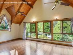  154 ENGLE ROAD REESVILLE QLD 4552 $1,300,000 ombining 34 acres of Land for Wildlife native Australian forest, walking tracks and a beautifully presented 12 year old Chalet Style home, this property meets the brief for privacy, tranquility and nature while also delighting the future buyer with a generously proportioned home. The land area on offer is noted for its significant Native Vegetation and therefore we believe the future buyer will have a keen desire to continue protecting this amazing natural resource. Enjoy the sounds from an array of birdlife and expect regular visits from the King Parrots. Your forest is also home to the Potoroo, with the site being recognised by Council as an important habitat for the preservation of this little animal. Well established walking tracks will take you on a circuit of the property and provide easy access for nature watching and general maintenance. Designed to bring the stunning environment close to the home, soaring cathedral ceilings are beautifully enhanced with window glazing to most of the north facing side of the home. On a moonlit night, you will enjoy the light filtering through the trees and in winter, the warming sun. The lower level of the home includes an entry hall, 3 bedrooms, main bathroom, laundry, well-appointed large kitchen and an open plan lounge / dining area which extends out to the front and rear verandahs. The upper level of the home provides a deluxe master suite with 2nd living area, main bedroom, walk-in robe, ensuite and verandah. Each of the rooms throughout the home are generously proportioned and with high ceilings, provide a luxurious sense of space. One of the outstanding aspects of this property is the gentle nature of the land. The parcel around the residence is near level, while the open space cow paddock and spring fed dam are all easily accessed and very user friendly. The property has an abundance of water with 45,000 litres collected from the home and a reliable bore reticulated to various parts of the property. Storage and workshop space should be ample with a double garage, double carport and a 9m x 6m shed. You may also wish to consider further development and build a few cottages. This property would offer the most outstanding eco style holiday stay if you were to obtain planning approvals for a number of cabins. This is an exciting opportunity to explore in so many ways. Secure your own outstanding slice of the Hinterland today! ** All information contained herein is gathered from sources we believe to be reliable. However, we cannot guarantee its accuracy and interested persons should rely on their own enquiries. 