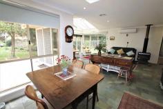  100 Balaclava St Balaclava NSW 2575 $868,000 JUST 3 MINUTES DRIVE TO MITTAGONG CENTRE IS THIS WELL PRESENTED FOUR BEDROOM HOME OFFERING A COMFORTABLE, RELAXED LIFESTYLE ON 1 1/4 ACRES GENEROUS, SUNNY, LIVING AREAS LEADING TO THE NORTH FACING GARDEN TERRACE * 4 bedrooms with robing * 2 modern bathrooms (ensuite to main) * Formal lounge with sliding French doors and dining with garden vistas * Well appointed kitchen with Ilve 5 burner cooker, stainless steel flue, Bosh dishwasher and an abundance of storage * Casual meals area adjacent to kitchen * Sunroom / family room with vaulted ceilings, under-floor heating, split-system air conditioning, slow combustion fire, skylight, sliding doors and bi-fold glass doors to terrace * Electric retractable awning over terrace * Ducted gas central heating * Bar-b-q area and terrace * Large shed / workshop (6m x 4m) * Tank + bore water for garden * Laundry with door to outside * Double garage with auto door * Zoning: R2 Low Residential - 700m2 minimum lot size * Landsize: 4904m2 SET BACK FROM THE ROAD ON AN ESTABLISHED 1 1/4 ACRES WITH NUMEROUS SPECIMEN AND FRUIT TREES THERE IS ALSO THE POSSIBILITY OF SUB-DIVIDING (S.T.C.A) AS THE ZONING IS MINIMUM LOT REQUIREMENT 700M2 ONLY A FEW MINUTES TO MITTAGONG CENTRE AND THE HUME MOTORWAY.. 