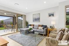  3 Halloway Boulevard North Kellyville NSW 2155 $1,150,000 Displaying a total commitment to modern family living, this stunning 5 year old single level Alkira designed home perfectly blends modern design cues and quality inclusions with a carefree low maintenance lifestyle set on a level 450 sqm block. Features include: - Wide entry foyer introducing large format porcelain tiles. - Spacious, contemporary kitchen, quality finished with stone bench tops and featuring a 900mm free standing oven with gas cooktop, canopy range hood, dishwasher and walk-in pantry. - The generous island bench with over mount sinks overlooks the adjacent dining space and casual living zone. - Carpeted home theatre with surround sound, ideal for family movie nights. - Master bedroom with walk-in robe and a wonderful ensuite. - Three additional queen sized bedrooms with built in robes plus an open plan media room. - Elegant main bathroom finished in neutral tones with bathtub and a separate powder room for guests. - Delightful tiled alfresco entertaining area with down lights and ceiling fan overlooking the low maintenance backyard. - Second timber deck - Double auto garage with internal access. - Creature comforts include two zone ducted air, gas outlets inside and out, down lights, blinds and remote alarm. This practical yet flowing floor plan will suit families as well as downsizers who don't want to compromise on quality. The location is superb, being walking distance to sought after amenities including the North Kellyville Primary School and moments to local shopping and an array of parklands and sporting fields. For more information contact Wayne Gay on 0403 052 226 to Tracey Paterson 0406 754 462.. 