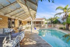  9 Albacore Drive Sorrento WA 6020 All offers presented by 6:00pm, Thursday 16th July 2020, unless sold prior. Ideal for a family that wants to live close to the beach but not too far from everything else, this elevated 5 bedroom 2 bathroom home will make for the perfect relaxing haven, once your own personal modern touches are added to it throughout. High raked ceilings and stylish light fittings grace a sunken formal lounge room off the entry, whilst the beautifully-tiled open-plan kitchen and dining area is also sunken and boasts a double storage pantry, a large fridge/freezer recess, double sinks, a dishwasher nook, a range hood, a Chef gas cooktop, Westinghouse oven, tiled splashbacks and outdoor access to the rear where a fantastic pitched patio and entertaining deck splendidly overlooks a sparkling below-ground solar-heated swimming pool with a bubbling spa and neighbouring tropical gardens. A carpeted family room can be found next to the dining space and features a corner wood fireplace and a split-system air-conditioning unit for all-seasons' comfort. Stepping up from the main living zone reveals a light, bright and spacious games room that is great for both kids and adults with its built-in bar/storage area, high ceilings, split-system air-conditioner, fan gleaming Bamboo floorboards, external poolside access and gorgeous double French doors for privacy. Also downstairs lies the main family bathroom with a separate bathtub and shower, as well as all five bedrooms - including a fifth bedroom-come-nursery next to a sublime front master suite, comprising of a walk-in wardrobe, another split-system unit, an intimate ensuite with a shower and toilet and a separate vanity/powder area for washing up. Upstairs, the large carpeted loft area can either be your study or another children's play area with roof storage access. Completing this wonderful package is a remote-controlled double lock-up garage with internal shopper's entry via the kitchen. Walk to the lovely Harman Park and Seacrest Village Shopping Centre at the bottom of the street, enjoy a leisurely stroll to nearby bus stops, the sprawling Seacrest Park Community Sporting Facility and Sacred Heart College and indulge in a very short commute to glorious Sorrento Beach, Hillarys Boat Harbour, the Sorrento Surf Lifesaving Club, coastal cafes and restaurants, more public transport, the freeway, Sorrento Primary School, Duncraig Senior High School, medical facilities and major shopping centres - Westfield Whitford City included. Sensual sea breezes await you here, there is no doubt about it! PROPERTY FEATURES; • 	 North-facing backyard, patio and swimming-pool setting • 	 Double-door entrance • 	 Sunken formal lounge • 	 Casual family room next to the kitchen/dining area • 	 Separate elevated games room • 	 Large upstairs study/loft area with roof access for storage • 	 Carpeted downstairs bedrooms, including 2nd/3rd bedrooms with built-in robes • 	 Practical tiled laundry with a storage cupboard and outdoor access • 	 Second ground-floor toilet, separate from the main bathroom • 	 Ample hallway linen storage • 	 Internal shopper's entry via the double garage • 	 Ducted-evaporative and split-system air-conditioning • 	 Security-alarm system • 	 Feature skirting boards • 	 Gas hot-water system • 	 Reticulation • 	 720sqm (approx.) block with two side-access gates • 	 Built in 1987 (approx.) LOCATION FEATURES; • 	 Walk to lush parks and the local shopping village • 	 Close to bus stops, other shopping centres and schools - including Sorrento Primary, Sacred Heart College and Duncraig Senior High • 	 Easy access to Sorrento Beach and Hillarys Marina • 	 Minutes from coastal cafes and restaurants • 	 Short commute to the freeway and other public-transport options.. 