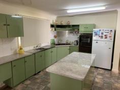  7 Gamble St Wyalkatchem WA 6485 $200,000 Timber framed, brick clad with an aluminium roof on a corner block of 1033m2. This house was built in 1969 and is in excellent condition. There are 3 bedrooms all of which are generous in size, all are carpeted, have air con and ceiling fans with the main bedroom having a built in robe. The bathroom has recently had major renovations done to it to allow for wheel chair access, every thing has been replaced and an extra WC having been added. A large linen cupboard is located in the hallway. Kitchen is large and very well appointed, lots of cupboard space,  a large pantry cupboard, electric wall oven and hot plate, vinyl floor covering, split air cond services the kitchen/dining room. Dining room is large with a sliding door opening  out onto the entertaining area and easy access to the large lounge room. Lounge room is carpeted with a large window to allow plenty for sunlight to fill the room plus ceiling fan, a gas bayonet is located in the passage for extra gas heating if required. A reading room/office which is also carpeted is located off the laundry.   A well equipped laundry with an additional shower and toilet and a tiled floor. HWS is electric, plus the house has a 20 panel solar PVA system to keep the power bills down. The front of the house has a veranda across part of the house, a rear veranda across the length of the rear of the house, the garage has a cement floor with power connected, a carport in front of the garage that has room for 2 vehicles. The low maintenance garden is all reticulated, a number of fruit trees, the property is well fenced in super six fencing, side access, 3 bird aviaries, and a large plastic rain water tank. This property is clean and tidy and has been well maintained over many years and is ready to move into with no additional money to be spent on it. Located close to the high school and within easy walking distance to the Doctor Hospital and aged care facilities. Viewing is by appointment only, to make an appointment please contact Eric on 0429886107 to arrange a time, you will not be disappointed with this property… 