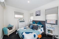  34 /1 Nevertire Street Lawson ACT 2617 $689,000 This beautiful and well-maintained home located in the “Gateway” complex in Lawson has a clever floor plan that will adapt to suit your needs. Use one of the four generously sized bedrooms as a spare living space or why not use one as your own personal office and work from home. The hub of the home is indeed the kitchen. You will adore the large kitchen complete with quality stone benchtops, ample storage space and Smeg appliances including a gas cooktop and dishwasher. The kitchen overlooks the open plan living which has high ceilings for that extra spacious feel while the meals area flows out onto your own private courtyard through double glazed sliding doors. The courtyard is the only one in the complex to feature a professionally installed and fully approved pergola to give you that extra protection from the elements when entertaining outside. Speaking of battling the elements you can be rest assured that you can enjoy year-round comfort with ducted heating and cooling, double glazed windows throughout and a Northern aspect. As the property is located on the northern end of the complex this creates an abundance of natural light that streams into the property. One of the best parts of living in the “Gateway” Lawson is the location, directly across from the University of Canberra, minutes away from Calvary Hospital, Australian Institute of Sport, Canberra Stadium, Belconnen Westfield shopping centre, cinema, cafés, restaurants, bars and fresh food markets. The location is also very close to Canberra City with major public transport routes nearby. This is only the second time one of the four-bedroom homes have hit the market for sale since being built. Do not miss out on your opportunity to secure this property in a prime location. Quality Features Include 4 bedroom townhouse Master bedroom includes an ensuite Ducted heating & cooling Modern kitchen with stone benchtops, dishwasher & gas hotplates Northern end of the complex creating an abundance of natural light Built-in robes to all bedrooms European style laundry Additional toilet in garage Beautiful courtyard with pergola Quality Crimsafe screens installed Double garage with remote.. 