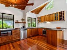  394 MOUNTAIN VIEW ROAD MALENY QLD 4552  $795,000 ucked privately away on an easy-care, one-acre parcel of land, this outstandingly presented home offers the perfect mix of classic character features with contemporary conveniences. Situated in the popular Mountain View Road area and only 3 kilometres east of Maleny, with walking and cycling paths to Mary Cairncross Park, nearby restaurants and into town, this property offers the ideal country lifestyle. The fully refurbished and freshly painted home provides our most sought-after criteria: - An expansive, open-plan living / dining / kitchen area with soaring ceiling - New Guinea Rosewood kitchen with quality appliances and stone benchtops - Most rooms flowing onto rambling, wrap-around verandahs - 3 spacious bedrooms, all with built-ins plus separate office / nursery room - 2 new and smartly appointed bathrooms - Artist studio / rumpus / home office and double lockup garage to lower level of house. Add to all this: a high level of privacy, the charming gardens, the stunning timber floors throughout and you have ticked all the most-popular boxes! 