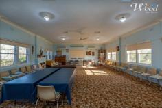  11 Lyne St Henty NSW 2658 The CWA Hall was purpose built and offers a huge 11m by 7.5m room to improve, insert patrician walls or run a home business from. Constructed in 1956 for the Country Women's Association, the double brick building offers a huge loungeroom which could be portioned at one end to create a master bedroom and en-suite if you put your mind to it. The room offers 2 split system air conditioners and a gas heater. There's 2 bedrooms, a tidy kitchen with a gas stove and also a bathroom with basic facility. In saying this, at one stage in its lifetime, a shower existed and still does, however the floor waste and shower recess has done the Houdini Act and disappeared. I am also fascinated in what was on the agenda for a laundry, because to date, I still haven't found one!! People often like my Character and honesty and today I am just telling you how it is, without any uncertain sales hype. Your welcome! I must talk up the toilet situation because you have 3 choices, although 2 need some work that are outside. Maybe one could be converted to a laundry. The glass is half full! I will actually talk up the wonderful parcel of land, which enjoys both road and rear lane access which is just under 1000sqm's. The rear block could accommodate large shedding, add an entertainment area or even extend the existing building. There is a garden shed on the property too and gas hot water. This is something different to offer an investor, community service with the RU5 zoning or a work from home business, taking advantage of the Grand Living space. I believe there will be plenty of varied usages so this in turn will generate plenty of interest. Get your skates on for this one and give us a call.. 