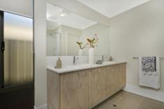  37 Aventurine Road Treeby WA 6164 $485,000 First-home buyers and young families alike will be eager to take full advantage of this quality brand-new Dale Alcock Projects built 3 bedroom 2 bathroom Green-Title home in the outstanding “Calleya Estate” where modern low-maintenance living meets an ultra-convenient location like no other. The State government has committed to building a new school in the estate that is estimated for completion by 2022, allowing you and your loved ones to enjoy a desirable lifestyle within a short drive of boutique shopping at Gateway Shopping City, as well as gorgeous walkways and biking trails nearby. A close proximity to local schools (including the Atwell Primary School and Atwell College catchment zones), Murdoch University, the Fiona Stanley Hospital, Cockburn Central Train Station, the freeway and a short 25-minute drive to our vibrant Perth CBD is simply just an added bonus here. Beyond lush green front lawns lies the house itself where a light, bright and beautifully-tiled open-plan family, dining and kitchen area doubles as a spacious central hub – sparkling stone bench tops, breakfast bar for casual meals, Artusi appliances and more. Like the bedrooms, an intimate theatre room is also carpeted for complete comfort, whilst the outdoor alfresco-entertaining area within the backyard is brilliant in its privacy. Why build when all of the hard work has already been done for you here? Just bring your belongings and move straight on in! WHAT’S INSIDE: • Gross Build Area (Under Roof) – 194sqm (approx.) • 3 bedrooms, 2 bathrooms – plus an E-Zone study nook • Huge open-plan living/dining/kitchen area with a double pantry, alfresco access, stone bench tops, stylish light fittings, a breakfast bar, double sinks, tiled splashbacks, a dishwasher recess, Artusi five-burner gas-cooktop and oven appliances and a stainless-steel range hood • Carpeted home office and bedrooms • Front master suite with a walk-in wardrobe and a sleek ensuite bathroom comprising of twin stone vanities, a shower and a separate toilet • 2nd/3rd bedrooms with full-height mirrored built-in robes • Stylish main family bathroom with a bathtub, a separate shower and a stone vanity • Tiled laundry with a full-height double mirrored linen/broom cupboard, a stone bench top and outdoor access to the side drying courtyard • Separate 2nd toilet • Linen press WHAT’S OUTSIDE: • Land area: 313sqm (approx.) • Rear alfresco-entertaining area off the family room, complete with outdoor power points, lush green lawn and a private backyard setting • Remote-controlled double lock-up garage with internal shopper’s entry and power and data points already connected • Neatly-tended front lawns EXTRAS: • Build by Dale Alcock Projects • High ceilings to passage, living areas, master bedroom and alfresco • Ducted and zoned reverse-cycle air-conditioning • Quality modern blind fittings throughout • Feature down lighting • Feature skirting boards • Instantaneous gas hot-water system • Colorbond fencing • Reticulated easy-care gardens • Side access LOCATION: • 25-minute drive from Perth CBD • Close to the freeway, shopping and public transport at Cockburn Central (just four stops to the city) • Walk to a plethora of local parklands with playgrounds, plus the Calleya Junior BMX Park around the corner • Local café and Nido Early School for children now up and running within estate.. 