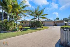  10 PETREA COURT ANDERGROVE QLD 4740 $599,000 I am excited to present this stunning property that the most astute of buyers will instantly fall in love with! There has been no stone left unturned & no expense spared to offer the highest degree of comfortable living for the busiest of families! At the end of a quiet culdesac, be introduced to the property via long concreted driveways & private, easy-maintenance gardens. The formal entry leads directly to a secluded private media room that can be closed off from the rest of the house for cozy movie nights. The cleverest of designs then allows the separation of the main living hub, via cavity-sliders, allowing the largest of families to have their own private spaces. An open-plan has been utilized within the kitchen using a large breakfast bench to overlook the formal dining & rumpus room. An adjacent office nook is positioned discretely off the dining room but is so easily accessible for sending quick emails, paying the bills, or working from home, whilst keeping an eye on the rest of the family! The kitchen bench & cupboard space is enormous, including a large corner pantry, generous fridge cavity & display cabinets. Timber-look floor panels in all traffic areas ensure that aching legs are a thing of the past & makes cleaning breeze. High ceilings throughout add to the flow of this open plan area, leading via glass sliding doors to the massive covered outdoor entertaining area & private inground pool. The outdoor entertaining area will cater for the largest of parties, as the adults can comfortably supervise swimming children. Stunning plantation shutters & self-watering landscaped gardens frame the entire entertaining area, with the afternoon sun being shielded from 2pm onwards. The intelligent design boasts segregation within the house, separating the bedrooms from the living area with the Master Suite located at one end of the house & all three other bedrooms - generously sized, built-in, carpeted, with fans - being located at the opposite end of the home. The master suite, being secluded from the major living areas, boasts a generously sized walk-in robe & efficient ensuite, with the entire room overlooking the pool. Storage is optimal at this property with many built-in linen & laundry cupboards . The main bathroom boasts modern feature tiles, both a plunge bathtub & separate shower, but part of the clever design sees another vanity basin outside of the main bathroom, acting as a powder room for guests. The well-sized laundry (dryer included in sale) leads directly to concreted surrounds, 5,000 litre rain tank & clothesline area. A bore on the property offers high-quality water & fills the pool for free! Every man will relish in the most enormous of Man-Caves - a triple bay with 2 bays being high clearance (door clearance 2970 x 2) - perfect for boats or caravans - PLUS an additional high clearance double carport, all on concreted driveways & all within a fully fenced block On a massive 1,069sqm block in such a central area of Andergrove, your new dream home is merely a signature away. The lifestyle afforded by this high caliber, low maintenance, beautifully designed property would be a joy to come home to each day! Be quick as properties of this standard rarely last long on the market. 