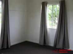  2 Blaxland Road Dalby QLD 4405 $165,000 Well maintained family home on 1272 Sq m fully fenced pet friendly block with 2 street access situated within a 10 minute walk to CBD and across the road from sporting grounds. A short walk to the footy club, The garden shed can double as a 'dog house'. 3 bedrooms with quality carpets all with robes, modern bathroom tiled with shower over bath and vanity, good sized air conditioned lounge and modern kitchen with plenty of natural light making the home very cheerful. Internal paintwork is good with quality curtains throughout External is weatherboard with a recent good quality paint job and low maintenance aluminium windows, screens and security doors. North facing front entry porch catches the morning sun. Stumps are steel adjustable for easy maintenance. 2 Carports, one south facing could be an entertainment area with direct access to the kitchen for easy grocery transfer, the other close at hand for the car. Current gross rental return is a healthy 7.4% 