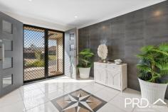  12 Acacia Avenue GOONELLABAH NSW 2480  $589,000 Stepping through the modern double doors to a wide entry with a lovely tiled feature wall, you will see the central kitchen with outdoor servery, breakfast bar and living/dining area that also opens to the outdoor area. Around to the right of the kitchen is the big second living area with bamboo flooring, air conditioning and bay style front window placements. This living room also opens to the outdoor area which completes a perfect design for entertaining. Moving to the hallway off the living/dining takes you to the bedrooms and the internal door to the DLUG, which is nice and close for unloading the shopping and bringing it to the kitchen. The bedrooms are all much larger than standard with built ins, carpet and ceiling fans. The central bathroom is massive and boasts a big corner spa, shower and double vanity. There's a separate toilet next to the bathroom. You will see tonnes of storage cupboards in the laundry. The huge master bedroom has its own ensuite with shower, toilet, vanity and separate walk in robe. Sitting on a 700m2 block the yard is very easy care with landscaped gardens, colourbond fencing and a small garden shed out the back. The outdoor entertaining area with insulated ceiling panels can be enclosed with its summer screens to keep nice and cool in summer or enjoy a cuppa in the warm winter sun. There's 3kw of solar panels, solar hot water, security screens on all doors, and tinted windows to keep you cool in the hot summer. Whether you are upsizing or downsizing, you must inspect this big beautiful home now and start enjoying an easy low maintenance life. Only minutes from the Goonellabah Shopping Centre, and close to schools, health services and all the amenties you may need. 
