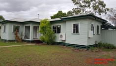  2 Blaxland Road Dalby QLD 4405 $165,000 Well maintained family home on 1272 Sq m fully fenced pet friendly block with 2 street access situated within a 10 minute walk to CBD and across the road from sporting grounds. A short walk to the footy club, The garden shed can double as a 'dog house'. 3 bedrooms with quality carpets all with robes, modern bathroom tiled with shower over bath and vanity, good sized air conditioned lounge and modern kitchen with plenty of natural light making the home very cheerful. Internal paintwork is good with quality curtains throughout External is weatherboard with a recent good quality paint job and low maintenance aluminium windows, screens and security doors. North facing front entry porch catches the morning sun. Stumps are steel adjustable for easy maintenance. 2 Carports, one south facing could be an entertainment area with direct access to the kitchen for easy grocery transfer, the other close at hand for the car. Current gross rental return is a healthy 7.4% 