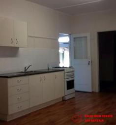  2 Blaxland Road Dalby QLD 4405 $165,000 Well maintained family home on 1272 Sq m fully fenced pet friendly block with 2 street access situated within a 10 minute walk to CBD and across the road from sporting grounds. A short walk to the footy club, The garden shed can double as a 'dog house'. 3 bedrooms with quality carpets all with robes, modern bathroom tiled with shower over bath and vanity, good sized air conditioned lounge and modern kitchen with plenty of natural light making the home very cheerful. Internal paintwork is good with quality curtains throughout External is weatherboard with a recent good quality paint job and low maintenance aluminium windows, screens and security doors. North facing front entry porch catches the morning sun. Stumps are steel adjustable for easy maintenance. 2 Carports, one south facing could be an entertainment area with direct access to the kitchen for easy grocery transfer, the other close at hand for the car. Current gross rental return is a healthy 7.4% 