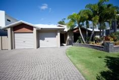  14 TURTLE PLACE BLACKS BEACH QLD 4740 $735,000 Inhale the sea breeze & exhale into a lifestyle of class & luxury! Turtle Place is a property of pure elegance, only footsteps away from the beach and minutes from retail & resorts; a location of peace and serenity yet also practicality. Four generously sized carpeted bedrooms, all with built-ins, ceiling fans & air conditioning will ensure comfort for the largest of families. The spacious open plan kitchen boasts a large stonetop island bench which acts as the central hub of the home, complete with breakfast bench perfect for morning cuppas, homework & chats while preparing dinner. There is ample cupboard space with built-in drawers in the pantry; a double fridge cavity; stunning tiled splashback & 5 gas burner cook top. The lounge & dining rooms are both open plan & are complimented by beautiful high vaulted ceilings, capturing amazing natural light and flowing breezes. Enter the outdoor entertaining area via sliding glass doors that overlook the resort styled inground pool & private, lush landscaped gardens (on automatic sprinkler systems & bore water). The Master Suite also overlooks the inground pool & is complete with walk in robe plus efficient ensuite. End a big day of sand, surf & swimming with a family movie, cuddled up in the air conditioned, tiled media room, that can be closed off from the remainder of the home, to offer extra seclusion. Then, sleep peacefully at the end of the day without the stress of water and power bills thanks to drinkable bore water & 6.6KW solar system (26 panels) that reduce these major costs. Let your dreams of resort-style living become a reality at 14 Turtle Place, surrounded by high caliber homes in a very family-friendly culdesac neighborhood. Disclaimer: The vendors and/or their agents do not give any warranty as to errors or omissions, if any, in these particulars, which they believe to be accurate when compiled. Prospective purchasers should satisfy themselves by inspection or otherwise as to the accuracy of the particulars. 