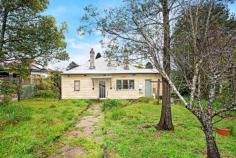  84 Cascade Street Katoomba NSW 2780 In a superb south side location, presenting a highly sought after opportunity to add value, this is a property you will definitely want to inspect! Located conveniently close to Katoomba town centre, shopping precinct, restaurants, schools and popular tourist destinations, sitting on a level sqm block is this c.1922 residence brimming with original character. The home maintains the architectural integrity of her time displaying features such as a central hallway flanked by four good sized bedrooms, some original floor boards, wrap around verandah (now closed in), high ceilings and wide cornices, fireplaces and the original cooker. The accommodation is 4 good sized bedrooms, large formal dining, lounge, plus closed in verandah forming a wrap around space creating extra room for kids/office/guest accommodation etc. The home sits on a flat corner block providing the perfect base for designing your own outdoor living space. Room for chooks, dogs and veggies! Working fireplaces x 2 Fenced Corner block with dual street access to Frank Ln Close to original layout.. 