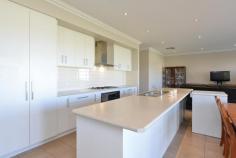  14B Purna Place Hannans WA 6430 $509,000 Welcome to your new home at 14B Purna Place. Tucked away in the cul-de-sac, there is no through traffic here and what a peaceful and private place to call your own. From the front you can see the property has used the 709sqm block to its full potential, leaving you with a great sized yard for the kids & pets alike, without skipping on size anywhere else. This two storey, brick & iron family home is more than meets the eye – just wait until you come inside! – From the entrance you will be greeted with beautiful tiled flooring and access to the garage from a separate door – you will notice the staircase to the right of the entrance hall – we will get to that in a moment… – Take a walk down the hallway – which is both bright & airy – then turn left, you will be taken to the main bedroom through double doors, what a grand feeling. The master bedroom is large in size and has the extras to make it luxurious including soft carpet, his and hers built in robes and an en-suite larger than the ordinary, including double vanity & huge mirror! – Coming back out from the master bedroom into the hall, you will walk into a large open plan kitchen/dining/living area – which is made to feel even larger with the tall ceilings & fancy cornicing – this is a great place for the family to come together after a busy day – The kitchen includes 900mm oven & stove top as well as stainless steel range hood & storage galore! The island bench is a great place for a relaxed breakfast in the morning before the day starts. – From the living area you walk through a second hallway to the second bathroom, laundry and remaining bedrooms which are all great sized and feature built-in-robes, soft carpet & blinds. – The family bathroom is close by the minor bedrooms and features a large bath, separate shower and vanity, there’s room in here to move. – Back to the front of the home and that staircase that you’ve been waiting for – The Views up here have been kept in mind when designing this home – you should come and look for yourself! Up here is a carpeted second living area with windows to take advantage of the scenery overlooking Karlkurla bushlands. The sunsets are amazing here. From this second living area is also an office or storage room, but it gets better than that. – The upstairs is set up to easily be used as a 5th bedroom and that office/storage room is already plumbed for a 3rd bathroom, so not only do you have options here but the hard work has been done, all you need to decide is what you want to use it for! – The whole home is serviced by refrigerated air conditioning, perfect for Kalgoorlie Summers when its just too hot to do anything else! – Heading outside you will be surprised at the size of the gabled entertaining patio, this is a great place for entertaining while still leaving a large grassed area for the kids to play which is easily maintained by the auto retic, don’t forget the good sized garden shed to hide away the gardening tools! This home is definitely worth a viewing to appreciate what we have here – to make an appointment to view contact Denise 0414 280 442 – you wont be disappointed. Rates: $2,703.24pa Water Rates: $240pa Zoning: R20 Block Size: 709sqm.. 