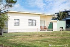  18 Oxley Street Swansea NSW 2281 $590,000 to $630,000 Whether you're hunting for a perfect and potential-packed first home, an easy-to-maintain weekender, or the home-base of a beautiful retirement, 18 Oxley Street has everything you need! This ready to move in to home in Swansea North that's bursting with possibilities - as well as a few surprising extras. Situated on a good-sized level 588 square metre block in the highly desirable Swansea North with a 21 metre wide frontage, with Chapman Oval and Swansea Channel to the street's east, and the shores of Lake Macquarie to the west. With much of the best of Swansea within 5 minute's walk, including Swansea Worker's club, everyday here can feel like a weekend! Modern bathroom, air conditioned living and new floor coverings to the lounge and hall, as well as a massive Queensland room to the rear, this is perfect for those weekend getaways. So what's inside? Let's take a look! - Air Conditioning - Two Garages AND an enclosed carport + garden shed - Solar Panels and Hot Water - Rain Water Tank - Built-in to main bedroom - Ceiling fans throughout - HUGE Queensland room- perfect for lounging and entertaining - Extra WC - Workbenches and ample storage in both garages - BIG back yard! 18 Oxley Street could be a stepping stone to the ultimate midsized family home or the perfect foundation for a budding design lover to create the cottage of their dreams! Don't let this one slip by, get in touch with Andrew or Bec on (02) 4972 1066 or email sales@andrewmcgrathfn.com.au to find out how to make it yours today! KEY FEATURES: Built in RobesDishwasherHot Water ElectricHot Water SolarWorkshopFully FencedRemote GarageShedSplit System (Air Con)Solar PanelsWater Tank 