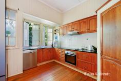  1 John Street Redcliffe Qld 4020 $645,000 Proudly residing atop a prominent corner allotment with south easterly sea views out to the bay this charming Queenslander epitomizes beauty in construction. Everything you expect from a character home is here including enjoying the warm sunrise or cool afternoon light from your wide timber entrance verandah. Come through the welcoming leadlight door and enter into a wide, high 3.2 metre ceiling open plan living and dining area with many french door openings with feature transom windows to the verandah for outside entertaining.  More leadlight features and coloured glass panels, internal timber fretwork, wide timber floorboards and surrounding VJ walls with chair rails all add to the classic style. There is room for a long dining table perfect for Christmas or family and friend get togethers which is complimented by the modernized timber kitchen with plenty of storage options, updated appliances and black Caesarstone bench tops. The three built- in queen size bedrooms are serviced by the updated large family bathroom with separate shower and bath featuring a skylight which will brighten your morning routine.  A second WC for your convenience is situated near the bedroom wing. There is reverse cycle air-conditioning in the living area and main bedroom plus ceiling fans to keep you cool in summer. A bonus separate study has its own independent access from the verandah – options aplenty! High timber fencing and established hedges provide privacy and surround the home plus there is driveway access to an enclosed extra height (2.7m) carport. There are still areas for you to add your own touches or improvements as there is room for further renovations downstairs under the new recent extension. Conveniently located less than 800m to the Margate shopping precinct, Sutton’s beach and cafés… everything including bus services and high school are also nearby. For the investor there is an established respectful tenant residing and inspections can be arranged by appointment. RARE FIND & STUNNING OPPORTUNITY IN POPULAR LOCATION... 