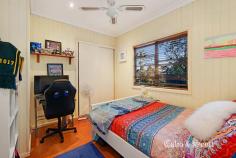  1 John Street Redcliffe Qld 4020 $645,000 Proudly residing atop a prominent corner allotment with south easterly sea views out to the bay this charming Queenslander epitomizes beauty in construction. Everything you expect from a character home is here including enjoying the warm sunrise or cool afternoon light from your wide timber entrance verandah. Come through the welcoming leadlight door and enter into a wide, high 3.2 metre ceiling open plan living and dining area with many french door openings with feature transom windows to the verandah for outside entertaining.  More leadlight features and coloured glass panels, internal timber fretwork, wide timber floorboards and surrounding VJ walls with chair rails all add to the classic style. There is room for a long dining table perfect for Christmas or family and friend get togethers which is complimented by the modernized timber kitchen with plenty of storage options, updated appliances and black Caesarstone bench tops. The three built- in queen size bedrooms are serviced by the updated large family bathroom with separate shower and bath featuring a skylight which will brighten your morning routine.  A second WC for your convenience is situated near the bedroom wing. There is reverse cycle air-conditioning in the living area and main bedroom plus ceiling fans to keep you cool in summer. A bonus separate study has its own independent access from the verandah – options aplenty! High timber fencing and established hedges provide privacy and surround the home plus there is driveway access to an enclosed extra height (2.7m) carport. There are still areas for you to add your own touches or improvements as there is room for further renovations downstairs under the new recent extension. Conveniently located less than 800m to the Margate shopping precinct, Sutton’s beach and cafés… everything including bus services and high school are also nearby. For the investor there is an established respectful tenant residing and inspections can be arranged by appointment. RARE FIND & STUNNING OPPORTUNITY IN POPULAR LOCATION... 