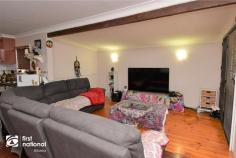  64 Malakoff Street Biloela QLD 4715 $259,000 If you are looking for a house that is a home in every sense of the word, 64 Malakoff Street may just be the one for you. Set back off the road, and sheltered by evergreen shrubbery, the paved driveway to the double carport takes you to the post and rail front patio. Step into the warmth of timber floors in the air-conditioned open plan lounge and dining space. The kitchen is well laid out and features a gas cooktop, corner pantry, plenty of bench space and storage. There are three bedrooms with built-in robes and air conditioning. The master bedroom has been updated with a his and hers walk though wardrobe to the en-suite. Step down through the glass and timber door, into the office and laundry area that also includes the family bathroom and separate toilet. This practical area could also serve as a rumpus for the kids. At the very rear of this home you will discover the expansive entertainment patio that has been beautifully lowered with retaining walls and features a high, insulated roof to help keep it cool in warmer months. The 6m x 6m powered lock up shed is located at the rear of the double carport, lawn locker and a rainwater tank are all contained within the privacy fenced yard. This home has a pervading sense of peacefulness and privacy that is only one of the benefits of a home that is pre-loved. If this home sounds like the place for you, arrange your personal inspection with Amanda or Ross at First National Biloela today. 