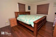  64 Malakoff Street Biloela QLD 4715 $259,000 If you are looking for a house that is a home in every sense of the word, 64 Malakoff Street may just be the one for you. Set back off the road, and sheltered by evergreen shrubbery, the paved driveway to the double carport takes you to the post and rail front patio. Step into the warmth of timber floors in the air-conditioned open plan lounge and dining space. The kitchen is well laid out and features a gas cooktop, corner pantry, plenty of bench space and storage. There are three bedrooms with built-in robes and air conditioning. The master bedroom has been updated with a his and hers walk though wardrobe to the en-suite. Step down through the glass and timber door, into the office and laundry area that also includes the family bathroom and separate toilet. This practical area could also serve as a rumpus for the kids. At the very rear of this home you will discover the expansive entertainment patio that has been beautifully lowered with retaining walls and features a high, insulated roof to help keep it cool in warmer months. The 6m x 6m powered lock up shed is located at the rear of the double carport, lawn locker and a rainwater tank are all contained within the privacy fenced yard. This home has a pervading sense of peacefulness and privacy that is only one of the benefits of a home that is pre-loved. If this home sounds like the place for you, arrange your personal inspection with Amanda or Ross at First National Biloela today. 