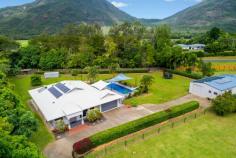  66 Dempsey Street Gordonvale QLD 4865 $895,000  This beautifully presented family property has everything that's required to make that easy transition into acreage living... The stunning home offers an enviable choice of living, dining and entertaining areas which flow seamlessly out to a vast covered alfresco entertaining area that overlooks a sparkling in-ground pool with kids slide. Centrally located, the chef's kitchen is complete with granite bench tops and an abundance of storage, ensuring preparing family meals or entertaining on a grand scale is done with ease and elegance. - Walk In Pantry / Gas Cooking - Two Drawer Dishwasher - Split System Air Conditioning - Solar Power ( 5kw )& Solar Hot water ( 46 Panels in Total ). The master bedroom provides comfort in size, there is a walk in robe and spacious ensuite with his & her vanity's and showers. The remaining three bedrooms have builtins, split air conditioning and the complete home is fully tiled. The shed measures in at 17m x 9m in size, there is power and water connected and four extra high roller doors. ( Space for your large boat and caravan ). At the front of the shed there is an added granny flat with bathroom, separate toilet and split system air conditioning. ( ideal for the older child or family friend that comes to stay ). There is also a doubled sized garden shed for storage of mowing / gardening equipment. This property is fully fenced with two street access, automatic entry gates, established gardens & privacy hedging. Gordonvale is 25 minutes drive South of Cairns CBD, there is shops, schools, doctors, sporting facilities, hotels and much much more. - 35 Minute Drive To Cairns Domestic & International Airport For More Information or Your Private Inspection Phone Brian Bolton 0n 0402 440 098 FEATURES: • 	 Air Conditioning • 	 Built-In Wardrobes • 	 Close To Schools • 	 Close To Shops • 	 Close To Transport • 	 Garden.. 
