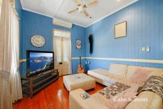  1 John Street Redcliffe Qld 4020 $645,000 Proudly residing atop a prominent corner allotment with south easterly sea views out to the bay this charming Queenslander epitomizes beauty in construction. Everything you expect from a character home is here including enjoying the warm sunrise or cool afternoon light from your wide timber entrance verandah. Come through the welcoming leadlight door and enter into a wide, high 3.2 metre ceiling open plan living and dining area with many french door openings with feature transom windows to the verandah for outside entertaining.  More leadlight features and coloured glass panels, internal timber fretwork, wide timber floorboards and surrounding VJ walls with chair rails all add to the classic style. There is room for a long dining table perfect for Christmas or family and friend get togethers which is complimented by the modernized timber kitchen with plenty of storage options, updated appliances and black Caesarstone bench tops. The three built- in queen size bedrooms are serviced by the updated large family bathroom with separate shower and bath featuring a skylight which will brighten your morning routine.  A second WC for your convenience is situated near the bedroom wing. There is reverse cycle air-conditioning in the living area and main bedroom plus ceiling fans to keep you cool in summer. A bonus separate study has its own independent access from the verandah – options aplenty! High timber fencing and established hedges provide privacy and surround the home plus there is driveway access to an enclosed extra height (2.7m) carport. There are still areas for you to add your own touches or improvements as there is room for further renovations downstairs under the new recent extension. Conveniently located less than 800m to the Margate shopping precinct, Sutton’s beach and cafés… everything including bus services and high school are also nearby. For the investor there is an established respectful tenant residing and inspections can be arranged by appointment. RARE FIND & STUNNING OPPORTUNITY IN POPULAR LOCATION... 