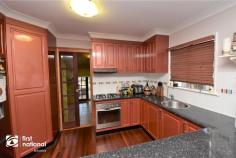  64 Malakoff Street Biloela QLD 4715 $259,000 If you are looking for a house that is a home in every sense of the word, 64 Malakoff Street may just be the one for you. Set back off the road, and sheltered by evergreen shrubbery, the paved driveway to the double carport takes you to the post and rail front patio. Step into the warmth of timber floors in the air-conditioned open plan lounge and dining space. The kitchen is well laid out and features a gas cooktop, corner pantry, plenty of bench space and storage. There are three bedrooms with built-in robes and air conditioning. The master bedroom has been updated with a his and hers walk though wardrobe to the en-suite. Step down through the glass and timber door, into the office and laundry area that also includes the family bathroom and separate toilet. This practical area could also serve as a rumpus for the kids. At the very rear of this home you will discover the expansive entertainment patio that has been beautifully lowered with retaining walls and features a high, insulated roof to help keep it cool in warmer months. The 6m x 6m powered lock up shed is located at the rear of the double carport, lawn locker and a rainwater tank are all contained within the privacy fenced yard. This home has a pervading sense of peacefulness and privacy that is only one of the benefits of a home that is pre-loved. If this home sounds like the place for you, arrange your personal inspection with Amanda or Ross at First National Biloela today. 