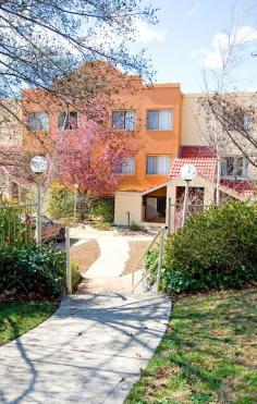  21/45 Leahy Close Narrabundah ACT 2604 $775,000+ This split-level, three bedroom, two bathroom, dual-living area home has been completely renovated - ready for you to move in and enjoy - and offers an easterly outlook with commanding views from Russell/Mt Ainslie over Canberra Airport through to Karabar and Jerrabombera. Double-glazed windows with security screens and plantation shutters offer both security and privacy, whilst the unique design of this home provides bedroom segregation and fully functional, integrated living areas. This larger than average town-house offers comfortable living environs throughout including open-plan formal living areas, a modern kitchen with adjoining family room - both of which enjoy sun-drenched mornings and each of which also extend onto private outdoor terraces. The upstairs living areas also feature full-width plantation shutters to the balcony and a remote-controlled Balinese fan. Floating floors in the entry hall, stairwell, family room, kitchen and upstairs hallway also add style and practicality to these high-traffic areas. The Kitchen has been fully renovated by "Kitchen Co" and features: a double Westinghouse oven; microwave and gas cooktop; a step-in pantry; oversized fridge space; raised breakfast bar; hidden cabinetry; integrated NBN; dimming down-lights; double black sink and ceaser-stone bench-tops and is complemented by soft-close drawers and loads of storage space. A gas ceramic fire-place sits atop a slate and Canberra-Brick hearth with an exposed flue/chimney. Entertainment needs are also covered with the 65" HDD LCD TV with sound-bar system and fully integrated antenna, HDMI and LAN connectivity throughout the home. Year-round comfort is also assured through the split-sytem, integrated aircon and heating. The Laundry and bathroom have also been fully renovated with an oversized HWS installed, built-in linen cupboard and laundry tubs - also fitted by KitchenCo. A frame-less shower-screen and rain shower-head complete the package. The renovated en-suite features built-in towel storage, a free-standing bathtub, frame-less shower-screen, shower panel, niche shaving cabinets and under-tile floor heating. Mirror doors to the built-in robes and a wall-safe add to the overall functionality and exceptional design of this home. Freshly painted throughout, both balconies have also been waterproofed and resealed, plumbed and the lower balcony has been fitted with a 20amp circuit for a future spa-install opportunity! The double garage has auto-door openers and additional security locks and wall panels fitted throughout. The complex also features an outdoor swimming pool and is in the catchment area for Blue-ribbon schools. 