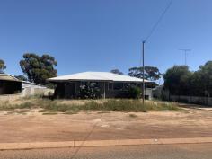  7 Dungey Rd Dalwallinu WA 6609 $250,000 Not often do homes of this size come along! Formerly a duplex premise, the main dividing wall has been removed to create one large 6 bedroom 2 bathroom home.  Typically laid out like a duplex, there are 3 bedrooms, 1 W/C & 1 bathroom with vanity & corner shower at one end of the home, while a further 3 bedrooms, 1 W/C, 1 bathroom with vanity & bath, laundry & basic kitchen with gas cooking & double stainless steel sink is at the other end of the home.  Lounge room is found at the front of the home off the entrance to the front door.  The main bedroom is the only room to have a small BIR.  Backyard is accessible via the laundry & has plenty of room to create what your dreams envisage.  Don't let looks fool you! Yes, this home needs TLC but once received will come up a beautiful large family home.  Dalwallinu is a small country town located in the wheatbelt region of Western Australia, located approx 250km north of Perth via the Great Northern Highway.The main townsite, Dalwallinu, is right in the heart of wildflower country and is the first town of The Wildflower Way, a world famous tourist route which stretches north to Mullewa. Primary economic activities are agriculture & supporting industries. Dalwallinu has multiple services available including an airstrip, 24/7 gymnasium, swimming pool, library, multiple parks, refuse site, hospital, medical centre & other health services that are conducted at different times & a district high school that caters for students up to year 10. More information about Dalwallinu can be found on their shire website page.  