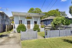  54 Connaught Street Sandgate QLD 4017 $588,850 This charm-filled cottage, circa 1920’s, a traditional Queensland beach-cottage infused with lashings of character, has been tastefully renovated and extended to the highest of standards; presentation, ambience, and location truly shine. The perfect size for a couple of small family, it comprises three bedrooms, two elegant bathrooms, stylish modern kitchen with adjoining dining, formal lounge, north-facing front porch, expansive covered back deck overlooking huge child/pet friendly backyard, and studio. Stunning polished pine floorboards, double hung windows, high ceilings, air-conditioning, ceiling fans, separate bath and shower in main bathroom, floor to ceiling tiles in both bathrooms, bifold timber framed glass stacker doors to deck, VJ feature wall in lounge, stone benches, stainless steel appliances, gas cooktop, gas hot water, garden shed, and studio/storage; are all features of note. Seamlessly blending old-world warmth with contemporary comforts – the overall effect works beautifully; generating timeless appeal that is increasingly sought after in the marketplace and becoming rarer and rarer. Aficionados of this vintage of home will adore this! The garden is fully fenced and easy care, and there is masses of room in the back yard for a trampoline, pool, cubbyhouse, and to park the tinnie…and so close the water, investing in a boat is money well spent. Located within walking distance to local parks, sporting ovals, Sandgate State School, shops, dining, and rail station; plus just a few minutes’ drive to the water, and 30 minutes to Brisbane CBD, an easy commute by train – this is not only a prime lifestyle location, but also close to essential services and amenities. This is super-cute and truly special; first to inspect will want to buy. Do not miss out! Contact us to arrange your very own private inspection today. Open 7 days Phone 07 3203 6001 (24 Hours) WE ARE TAKING ALL CARE AND PRECAUTIONS REQUIRED DURING THIS COVID-19 FLU VIRUS EVENT.. Features we love : • Charming 1920’s style cottage • Tastefully renovated & extended • 3 bedrooms, 2 elegant bathrooms • Modern kitchen with stone benches • Expansive covered rear deck • Polished pine timber floors • Ceiling fans, A/C, gas hot water • Garden shed, studio/storage • Fully fenced easy-care 506m2 block • Huge child & pet friendly backyard • Walk to local amenities incl: rail • Presentation, location, character!! 