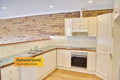  2/157 GREGORY STREET SOUTH WEST ROCKS NSW 2431 $439,000 If you are looking for a low maintenance quality three bedroom townhouse that needs absolutely no money spent on it then this property is available for your inspection now. Open style living area that opens out on to a large balcony with commanding views to the Golf Course and Smoky Mountain. Timber flooring throughout, modern kitchen, brand new main bathroom, semi ensuite in the main bedroom plus full length wardrobe. The double garage enjoys remote roller door access plus huge separate workshop / storage area. Fully fenced side and rear yard. This property has enjoyed an excellent rental occupancy for the past 20 years, however in its present condition would certainly be a superb home to call your own. 