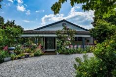  7 Ross St Bundanoon NSW 2578 $895,000 Fabulous 3 bedroom home with a pretty garden vista from every room and deep verandahs accessed via French doors offering an ease of living and making the most of the elevated green outlook. Renovated country kitchen offers timber benches, butlers sink and 900mm stainless freestanding oven/cook top; Fully renovated family bathroom with a second separate wc and spacious laundry with storage and bench space; Open plan living offers gas heating and flows directly off the kitchen and out to the verandah, a major selling point of this property; Outdoor BBQ area to the north and privately screened from neighbours; Excellent storage throughout, with all bedrooms having built-ins plus 3 bay linen cupboard in the hall and exceptional under house storage and shedding; Double garage at the rear could easily be used for garaging vehicles with side access available alternatively there is plenty of off street parking in the front parking bays. A home full of surprises with various garden rooms and year round colour guaranteed, from the various maples, Jacaranda tree, shrubbery and garden beds. There is a raised vegetable garden to the rear plus a 5 star chook shed and under house water tank. All town services available to this painted brick cottage and a healthy walk to the village centre. 