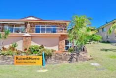  2/157 GREGORY STREET SOUTH WEST ROCKS NSW 2431 $439,000 If you are looking for a low maintenance quality three bedroom townhouse that needs absolutely no money spent on it then this property is available for your inspection now. Open style living area that opens out on to a large balcony with commanding views to the Golf Course and Smoky Mountain. Timber flooring throughout, modern kitchen, brand new main bathroom, semi ensuite in the main bedroom plus full length wardrobe. The double garage enjoys remote roller door access plus huge separate workshop / storage area. Fully fenced side and rear yard. This property has enjoyed an excellent rental occupancy for the past 20 years, however in its present condition would certainly be a superb home to call your own. 