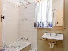  38 Lobelia Avenue Wundowie WA 6560 $150,000 Exhibiting an honest charm with its high ceilings and well-proportioned rooms this 1950 Wundowie original, although faded and in need of TLC, is an excellent example of unfulfilled potential. Occupying an elevated position on a 1012 sqm lot with a large, shady backyard, the 2 bedroom, 1 bathroom home is ready and waiting for someone to appreciate and uncover its allure. • 	 2 bedrooms 1 bathroom • 	 1950-built fibro and tile • 	 Renovators’ delight • 	 OP family/kitchen/meals • 	 High ceilings orig windows • 	 Activity/studio/sleepout • 	 Screened rear verandah • 	 Lge shady north face yard • 	 Elevated 1012 sqm block • 	 Walk town, school, pool Roses and lavender surround the front steps of this original Wundowie cottage. The fibro and tile home sits on an elevated lot and boasts a front porch with views to nearby bushland and across to a distant ridge. An open plan family room, kitchen and meals area offers the first glimpse of the potential of high ceilings and original windows. The carpeted family room enjoys views to the south and features an ornamental brick fireplace. The kitchen/meals area is large enough to accommodate a table and fitted with a U-shaped bench and freestanding oven. A reverse cycle air conditioner in the family room provides year-round climate control. Adjoining the kitchen is an additional living space with the potential of forming part of a larger, renovated kitchen. With access to the screened porch and backyard, this good-sized room could also be styled as a study or activity space. The well-proportioned main bedroom sits at the front of the home with reverse cycle air conditioner, the room has  windows to the south and is shaded by a tall pepper tree. Both bedrooms are carpeted and benefit from high ceilings. A family bathroom with over-tub shower and vanity and a separate W.C. are arranged off the walk-through laundry. A brick-paved verandah edged with raised garden beds leads from the screened porch to the spacious backyard where a garden shed, and carport provide handy storage space –  a drive-through carport sits at one side of the home. The country-style verandah looks out to established fruit trees and lush grape vine. Wundowie is a well-serviced country town with the infrastructure needed for a self-supporting community, including a police station, medical centre, ambulance station, fire brigade, community centre, library, post office, daycare, fantastic sporting facilities, public swimming pool and more.    There is no denying that hard work is required to make this faded rose bloom again, but sharp pricing and a great position make this a tempting prospect. To arrange an inspection of this property and experience the real difference in real estate call Mr Real – Nigel Williams – 0417 988 680. 