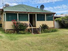  11 Cowley Street Boyup Brook WA 6244 $129,500 This first starter home gives you the opportunity to get into your first home if you are looking for a project to renovate or perhaps you have been thinking of taking on the role as a landlord then this is the one for you. Watch the world go by under the front verandah of your lovely 3 bedroom 1 bathroom home situated on a 1183m2 block. Two of the three bedrooms are roomy enough to accommodate queen size beds, the other bedroom suits a single or double. Conveniently located on a quiet street in walking distance to the town centre that boasts a variety of services consisting of a local supermarket, cafes, doctors, chemist, mechanic, tyre services and a post office. The home boasts Oregon pine floors and the living area provides you with the creature comforts of an air conditioner providing relief during the summer months plus a cosy woodfire heater for the cooler winter. The country style kitchen/dining area has the convenience of gas cooking, the bathroom consists of a shower over bath and basin. There is a separate laundry and toilet and the home runs on an instant gas HWS. Outside on the back verandah you have an undercover entertainment area that overlooks the large backyard, the perfect spot to entertain family and friends. There is off street parking for 3 cars with enough space out back for a caravan or boat - rear drive thru access possible from the front driveway to spacious back yard with room for a workshop. The rear of the yard is home to a chook pen along with an apple, an apricot and a lemon tree. If you wish, the Seller is prepared to leave behind the majority of the of the furniture and contents of the property as they are going to be surplus to needs. This home can basically be sold "as is" if that suits you. Rates are $1455.05 Per Annum For more information or to view please contact John Rich or Lisa Freer on 0429 101 264 