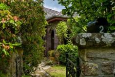  2 Nicholas Ave Bundanoon NSW 2578 $1,050,000 This gorgeous character double brick residence set amongst a stunning old established cottage garden will win over even the most discerning of buyers. Showcasing all the traditional features one would expect in a home of this vintage from the tiled entry porch to the back door and gardens beyond. 10ft ceilings, timber floor boards, large skirtings, fret work, picture rails, highlight shelving, stained glass windows, stained glass cabinetry throughout and window seats in the two main bedrooms plus open fire place to one Freshly painted and lacquered floorboards throughout most of the home Master bedroom has extensive built in robes and modern ensuite with underfloor heating and highlight windows Two bedrooms can be configured many ways with one having a utilities room perfect as a home office, sitting room or child’s play room whilst the 4th bedroom accesses the rear deck and would make an excellent work from home space Main bathroom is both quirky and charming with timer panelling, stained glass features and sky light Generous dining room (or second lounge) with open fire place and servery to the centrally located kitchen Country kitchen offers space for a small table or island bench and offers a 900ml ilve stainless stove and oven built into the chimney space plus a walk in pantry and skylight Casual living space warmed by a s/c wood fire at the rear of the home is bathed in northern sunshine and accesses the timber entertaining deck and magnificent garden beyond Excellent thermal qualities due to double brick construction plus gas ducted heating, multiple fire places and gas points throughout Ample storage given the age of the home with a double linen cupboard, built in cabinetry throughout and huge laundry / mud room with 3rd wc Set behind a sandstone and iron fence the gardens are a special feature of this property, ensuring privacy and a green outlook from every room. The garden offers a series of well organised hedges, garden beds set around old established trees, colourful shrubs and stone walkways. The charming gazebo or artist studio space is a focal point of the rear garden. There are two well positioned garden sheds plus a double gate and gravelled parking bay within the fence line. Within walking distance to the village and a cul-de-sac location, this old gem won’t sit long waiting for its new owner. 