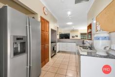  24 Loaders Ln Coffs Harbour NSW 2450 $899,000 - $949,000 Set on just over 2500m2 this private and spacious home is sure to impress. Only minutes from the CBD of Coffs Harbour, this is a rare find in the current market and will certainly appeal to a large range of buyers. The home itself is very spacious and includes multiple living zones and large bedrooms. The main bathroom has recently been renovated and is finished with floor to ceiling tiles and quality fixtures and fittings. The kitchen is original but in very good condition and comes with solid granite benchtops and modern appliances. The functional floor plan has been designed with the family in mind and one end of the house is great for kids or guests and can be closed off from the rest of the house and made fully self contained. The master bedroom with ensuite is privately tucked away at the opposite end of the house and looks over the private rear lawn and gardens. For the entertainer this home is perfect with a huge living area that can be opened up on both sides with a sparkling inground pool on one side and the beautiful greenery of the park like gardens on the other side. For those craving space and privacy this home has got the lot with a mostly level rear yard leading down to the picturesque creek as your rear boundary. Extra vehicles are also well catered for with a 4 bay lock up shed, carport for a large caravan or boat, plus another double carport in front of the house and there is also side access to the rear yard. This is a once in a lifetime opportunity to secure a large house on a large parcel of land in such a convenient location. Don't hesitate as this one will not last long! 