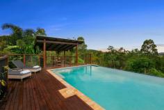  14 Trainstop Court Bli Bli QLD 4560 $1,395,000 This Hamptons inspired residence is hidden away in a very quiet part of the Sunshine Coast with a forest backdrop and a brilliant vista. Obvious to all who view is the quality of this home with its mix of indoor and outdoor living. The open plan design is complimented by the fact that there are areas where you can be by yourself at any time. Central to the home is a gourmet kitchen fitted with a 5 burner gas cook top and a 900mm country oven, stone bench-tops and a huge 4 metre island bench. There are three distinct covered outdoor entertainment areas ranging from a gazebo alongside a 10 x 5m resort style pool to a view deck on the main living and another off the lower level. This self-contained lower level represents options like guest accommodation, work from home with NBN coverage or even generate an income with rental possibilities. The professionally landscaped gardens are serviced by a computerised fully programmable irrigation system, plus town water, a quality bore and a bonus 20,000 litre rain water tank. As well as garaging for 4+ vehicles, there is a huge air-conditioned room (6.7 x 5m) would be perfect for jet-ski's, motor bikes, studio, fitness training, consultation or workshop. Only an inspection will show you just how good this very private residence will be for your family. • 	 Four spacious bedrooms all with robes plus a dedicated office • 	 Main bedroom with ensuite, walk-in-robe and private deck • 	 Covered alfresco dining areas • 	 Hardwood timber flooring throughout • 	 Extremely private location in quiet cul-de-sac • 	 Ducted air-conditioning & LED lighting • 	 Modern kitchen featuring stone bench tops • 	 Self-contained lower level with second double garage and large workshop • 	 Powered 6 x 3m shed • 	 Plenty of parking for additional cars or caravan • 	 6,883m2 allotment • 	 5 minutes to Bli Bli shopping centres • 	 18 Minutes to Sunshine Plaza. • 	 12 minutes to Sunshine Coast Grammar • 	 13km to Mudjimba Beach • 	 12 minutes to Sunshine Coast International Airport • 	 20 minutes to Sunshine Coast University FEATURES: • 	 Air Conditioning • 	 Built-In Wardrobes • 	 Dual Living • 	 Formal Lounge • 	 Garden • 	 Polished Timber Floor.. 