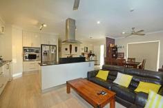  15 Hills Avenue Biloela QLD 4715 $459,000 A low set brick home set on 4007sqms* in an established neighbourhood, on the edge of town. This is just for starters. A large, open plan living and dining with a very stylish and renovated kitchen. Finished in white two-pak, stone benches and equipped with quality appliances. Three good sized bedrooms with ceiling fans, air-conditioning and built-in robes. The master has an impressive ensuite and a walk-in robe. Outside, the 9m* x 6m* undercover entertainment area is the perfect spot to entertain or just kick back and relax. From here you can enjoy the company of family and friends and the in ground, saltwater pool. Just perfect for our long, hot summers. A 3 bay (2 door), powered shed as well as a separate car port allows parking accommodation for up to 5 vehicles. The acre is fully fenced with an underground sprinkler system to keep the lawn green and make good use of the included John Deere, 0 Turn ride-on mower. All of this and still more so inspection is highly recommended. Private inspections are available upon request. FEATURES: • 	 Air Conditioning • 	 Built-In Wardrobes • 	 Garden • 	 Secure Parking.. 