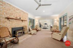  24 Loaders Ln Coffs Harbour NSW 2450 $899,000 - $949,000 Set on just over 2500m2 this private and spacious home is sure to impress. Only minutes from the CBD of Coffs Harbour, this is a rare find in the current market and will certainly appeal to a large range of buyers. The home itself is very spacious and includes multiple living zones and large bedrooms. The main bathroom has recently been renovated and is finished with floor to ceiling tiles and quality fixtures and fittings. The kitchen is original but in very good condition and comes with solid granite benchtops and modern appliances. The functional floor plan has been designed with the family in mind and one end of the house is great for kids or guests and can be closed off from the rest of the house and made fully self contained. The master bedroom with ensuite is privately tucked away at the opposite end of the house and looks over the private rear lawn and gardens. For the entertainer this home is perfect with a huge living area that can be opened up on both sides with a sparkling inground pool on one side and the beautiful greenery of the park like gardens on the other side. For those craving space and privacy this home has got the lot with a mostly level rear yard leading down to the picturesque creek as your rear boundary. Extra vehicles are also well catered for with a 4 bay lock up shed, carport for a large caravan or boat, plus another double carport in front of the house and there is also side access to the rear yard. This is a once in a lifetime opportunity to secure a large house on a large parcel of land in such a convenient location. Don't hesitate as this one will not last long! 