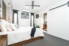  5 Murrabibbi Street Leanyer NT 0812 This superbly renovated elevated home features stylish on-trend interiors flowing onto large front and rear decks for seamless alfresco living in a lush garden setting. High-end designer appointments will impress throughout, and you'll love this convenient central location family-friendly that's a short stroll to Hibiscus Shopping Centre and Leanyer Primary School, and close to Casuarina Square. Open-plan living/dining area flows onto huge front and rear decks Designer gas kitchen with stone-look bench tops and butler's pantry Carpeted master bedroom with walk-in robe and luxury ensuite Chic master ensuite with large shower and partitioned toilet Built-in robes to good-sized second and third upstairs bedrooms Main bathroom with striking freestanding bath and frameless glass shower Split-system air conditioning and ceiling fans throughout Large downstairs fourth bedroom plus bathroom and laundry Huge under-cover alfresco entertaining area plus in-ground pool Under-house parking for four cars; garden shed for extra storage Glass louvre windows throughout invite cooling tropical breezes for fresh contemporary living, and crisp neutral tones and textures will beautifully compliment your modern interior design. Take the external staircase up to the huge front deck that opens into the spacious open-plan living/dining area that is superbly presented with marble-look floor tiles and access onto the rear balcony. The stylish adjoining kitchen is a standout feature of the home with stylish pendant lighting, premium modern cabinetry, stone-look bench tops, a freestanding stainless steel gas stove, and large butler's pantry. A short hallway connects to the three light-filled upstairs bedrooms, and the stunning main bathroom that will delight with a striking freestanding bath, large frameless glass shower and floor-to-ceiling tiles. There are built-in robes to the second and third bedrooms, and the master features a walk-in robe and an immaculate modern ensuite. Downstairs, the large fourth bedroom joins another full-sized bathroom and separate laundry to suit use as a teenager's retreat, private guest accommodation or a home office. The sparkling in-ground pool will be a hit with your whole family, and lush established gardens create a private, tranquil setting for this quality home. Be first in line to see it! Area Under Title: 1200 Square Metres Planning Scheme Zone: SD (Single Dwelling) Darwin Council Rates: $1,850 Per Annum (Approximately) Year Built: 1982 No Easements found on Title FEATURES: • 	 Air Conditioning • 	 Built-In Wardrobes • 	 Close To Schools • 	 Close To Shops • 	 Close To Transport • 	 Garden.. 