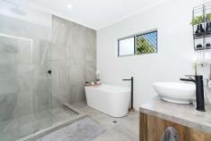  5 Murrabibbi Street Leanyer NT 0812 This superbly renovated elevated home features stylish on-trend interiors flowing onto large front and rear decks for seamless alfresco living in a lush garden setting. High-end designer appointments will impress throughout, and you'll love this convenient central location family-friendly that's a short stroll to Hibiscus Shopping Centre and Leanyer Primary School, and close to Casuarina Square. Open-plan living/dining area flows onto huge front and rear decks Designer gas kitchen with stone-look bench tops and butler's pantry Carpeted master bedroom with walk-in robe and luxury ensuite Chic master ensuite with large shower and partitioned toilet Built-in robes to good-sized second and third upstairs bedrooms Main bathroom with striking freestanding bath and frameless glass shower Split-system air conditioning and ceiling fans throughout Large downstairs fourth bedroom plus bathroom and laundry Huge under-cover alfresco entertaining area plus in-ground pool Under-house parking for four cars; garden shed for extra storage Glass louvre windows throughout invite cooling tropical breezes for fresh contemporary living, and crisp neutral tones and textures will beautifully compliment your modern interior design. Take the external staircase up to the huge front deck that opens into the spacious open-plan living/dining area that is superbly presented with marble-look floor tiles and access onto the rear balcony. The stylish adjoining kitchen is a standout feature of the home with stylish pendant lighting, premium modern cabinetry, stone-look bench tops, a freestanding stainless steel gas stove, and large butler's pantry. A short hallway connects to the three light-filled upstairs bedrooms, and the stunning main bathroom that will delight with a striking freestanding bath, large frameless glass shower and floor-to-ceiling tiles. There are built-in robes to the second and third bedrooms, and the master features a walk-in robe and an immaculate modern ensuite. Downstairs, the large fourth bedroom joins another full-sized bathroom and separate laundry to suit use as a teenager's retreat, private guest accommodation or a home office. The sparkling in-ground pool will be a hit with your whole family, and lush established gardens create a private, tranquil setting for this quality home. Be first in line to see it! Area Under Title: 1200 Square Metres Planning Scheme Zone: SD (Single Dwelling) Darwin Council Rates: $1,850 Per Annum (Approximately) Year Built: 1982 No Easements found on Title FEATURES: • 	 Air Conditioning • 	 Built-In Wardrobes • 	 Close To Schools • 	 Close To Shops • 	 Close To Transport • 	 Garden.. 