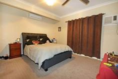  15 Hills Avenue Biloela QLD 4715 $459,000 A low set brick home set on 4007sqms* in an established neighbourhood, on the edge of town. This is just for starters. A large, open plan living and dining with a very stylish and renovated kitchen. Finished in white two-pak, stone benches and equipped with quality appliances. Three good sized bedrooms with ceiling fans, air-conditioning and built-in robes. The master has an impressive ensuite and a walk-in robe. Outside, the 9m* x 6m* undercover entertainment area is the perfect spot to entertain or just kick back and relax. From here you can enjoy the company of family and friends and the in ground, saltwater pool. Just perfect for our long, hot summers. A 3 bay (2 door), powered shed as well as a separate car port allows parking accommodation for up to 5 vehicles. The acre is fully fenced with an underground sprinkler system to keep the lawn green and make good use of the included John Deere, 0 Turn ride-on mower. All of this and still more so inspection is highly recommended. Private inspections are available upon request. FEATURES: • 	 Air Conditioning • 	 Built-In Wardrobes • 	 Garden • 	 Secure Parking.. 