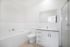  42 McBeath Street Hectorville SA 5073 $490k-$510k Completed in 2016, this Torrens titled custom home by Eastern Building Group offers two spacious levels, three bedrooms and three living areas for the modern family. Enjoying frontage onto McBeath Street among other quality homes, enter into the first downstairs living space between 2.7m ceilings and easy-care porcelain tiles to find an airy bright home. Facing the front of the home, a carpeted lounge enjoys wonderful natural light, while travelling down the hall, emerge in the open plan living and take in all the wonderful space, allowing you to configure your dining and lounge as you wish! Under LED downlighting, the kitchen offers contrast cabinetry and a sleek island bar, while stainless steel appliances include a dishwasher and gas cooktop for ultimate convenience. Upstairs to the carpeted sleeping quarters, find two bedrooms with built-in robes, separated from the main bedroom by a generous bathroom and third family room – meaning each bedroom gets their own living space to relax. The main bathroom offers a large shower and bath tub, while the master suite is complete with walk-in robe and ensuite bathroom. Surrounded by private good neighbour fencing, landscaping is easy care to the front and rear, with just enough lawn to satisfy pets and four-legged family members. Opening up glass sliding doors to the backyard, there’s plenty of room to extend and create an undercover dining area – or just kick back and enjoy dining Alfresco. It’s as effortless as it should be. Moments from Denis Morrissey Park, Campbelltown Library, public transport and local shopping, while just 6.5km to the city, everything you need is right here in Hectorville. Don’t miss: – The lounge downstairs can be easily converted into a bedroom or multi function entertaining area. – Super easy access to shopping centers: apart from the walking distance to Foodland and grocery store on St Bernard Rd, 5 mins drive to Newton shopping center with Woolies and Coles, 5 mins drive to Coles/Kmart Firle shopping center, 4 mins drive to Drakes Newton – Reverse cycle ducted air-conditioning – Guests’ powder room and generous laundry – Secure garage with auto panel lift door – Fully insulated internal & external walls – Exposed aggregate driveways and perimeter paths – Stroll to Romeo’s Foodland and public transport on Saint Bernards Road – Walking distance to East Torrens Primary and zoned to Norwood Morialta Middle and Senior Schools – Easy commute to the Adelaide CBD down Montacute and Payneham Roads.. 