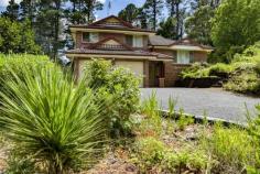  4 Ben Nevis Cct Bundanoon NSW 2578 $1,045,000 This solid brick and tile residence is spread over 3 levels and offers fabulous spaces for the whole family. Set amongst glorious grounds with privacy and perfect northern exposure assured. A blue ribbon location with distant escarpment views in the village of Bundanoon. All four bedrooms are generous in size with excellent storage available, the master suite offering a walk in robe and huge ensuite. The main bathroom is also sizable and is situated on the upper level to service the 3 double bedrooms; There is potential for a fifth bedroom on the ground floor currently used as the home office with access to the guest powder room; Living is spread over the lower level and mid level of the home with both casual and formal living and dining spaces perfect for entertaining and the growing family; The modern kitchen accesses the rear verandah and offers stone bench tops and quality finishes. The formal dining and casual dining space both flow seamlessly to the kitchen space and outdoor BBQ area; There is ducted heating and cooling plus a flued gas heater in the casual family / rumpus area which also accesses its own private terraced area, fully enclosed, perfect for the little ones or family pet; The double garage has internal access into the entry foyer and offers more storage options, with side access to the rear yard also available and plenty of off street parking. Set well back from the street, the park like grounds offer a mix of established trees, garden beds, retaining walls, year round colour and large level grassed areas. A fabulous family home in a quiet leafy location within walking distance to the charming village. Call Megan to arrange your private inspection. 