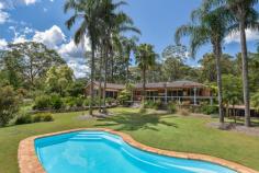  459 Kyola Road Kulnura NSW 2250 This elevated, quiet and private 27 acre holding includes approximately 10 acres of beautiful clear to semi-clear flat to gently sloping land, together with an impeccably presented large 4-bedroom home with extensive undercover alfresco entertaining area and pool, all set off by a world class Australian Native garden, offering a stunning array of spectacular Australian flora & fauna! A substantial 12.5m x 12.5m steel shed complete with 3-phase power tops off this unique package and has separate access. Separate adjacent shed, 15.8m x 4.8m. Water is plentiful via both rain tanks and bore supply for garden irrigation system. The area is a mecca for horse enthusiasts with entry opposite this property to the McPherson State Forest riding trails. The home has a near new quality kitchen, spacious bedrooms, main with ensuite, delightful main bathroom, and multiple large living areas, both formal and informal. Floor coverings and window treatments are all to a high standard. There is air conditioning and a large combustion fire. The home requires no work by the new owners and offers a wonderful retreat for buyers wanting a peaceful, rural lifestyle on the back doorstep of the Central Coast and Sydney. Access to Wahroonga is via the M1 and is under 1-hour driving, while the facilities of the Central Coast are less than 30 minutes away. 