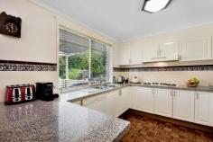  4 Ben Nevis Cct Bundanoon NSW 2578 $1,045,000 This solid brick and tile residence is spread over 3 levels and offers fabulous spaces for the whole family. Set amongst glorious grounds with privacy and perfect northern exposure assured. A blue ribbon location with distant escarpment views in the village of Bundanoon. All four bedrooms are generous in size with excellent storage available, the master suite offering a walk in robe and huge ensuite. The main bathroom is also sizable and is situated on the upper level to service the 3 double bedrooms; There is potential for a fifth bedroom on the ground floor currently used as the home office with access to the guest powder room; Living is spread over the lower level and mid level of the home with both casual and formal living and dining spaces perfect for entertaining and the growing family; The modern kitchen accesses the rear verandah and offers stone bench tops and quality finishes. The formal dining and casual dining space both flow seamlessly to the kitchen space and outdoor BBQ area; There is ducted heating and cooling plus a flued gas heater in the casual family / rumpus area which also accesses its own private terraced area, fully enclosed, perfect for the little ones or family pet; The double garage has internal access into the entry foyer and offers more storage options, with side access to the rear yard also available and plenty of off street parking. Set well back from the street, the park like grounds offer a mix of established trees, garden beds, retaining walls, year round colour and large level grassed areas. A fabulous family home in a quiet leafy location within walking distance to the charming village. Call Megan to arrange your private inspection. 
