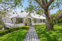  96 Simpsons Road Bardon QLD 4065 Situated in the prestigious locale of Bardon you will find this exceptionally restored Queenslander. From the moment you step through the iron gates you are greeted by a striking entryway surrounded by beautifully manicured gardens leading you to the spacious front verandah. Walking through the front door you will be immediately taken by the traditional features such as the VJ walls, beautiful timber floors, pressed ceilings and stunning light fixtures. Heading into the main living area you will find an open plan formal living and dining room are adorned with sparkling chandeliers, natural light plus an original working fireplace. Each room is lined with doors which flow out to the wrap around deck creating the perfect space to entertain. Beautiful feature doors open to a separate family room and the grand chef's inspired kitchen. This fantastic kitchen offers ample storage and bench space plus a large over-sized island with additional seating at the breakfast bar. The kitchen opens onto the spacious rear deck with stunning views of Bardon and out to the Brisbane CBD. The upper level of this home also offers a large master suite with a walk-in robe and decadent ensuite with dual vanities plus a large shower. You will also find an additional bedroom which can be utilised as a study or home office with its own private entry. Heading downstairs you will find a rumpus room with custom built-in storage and large sliding doors opening onto the undercover entertaining area. Here you can access the sparkling in-ground pool and low maintenance backyard. The lower level also offers four additional bedrooms, three with access to the enclosed verandah and built-in robes all serviced by the glamourous family bathroom. The other bedroom has a private jack-and-jill ensuite with access to the rear courtyard. There is no shortage of space in this home with a three car garage with additional built-in storage, wine cellar and a large laundry. The home sits across two blocks with a beautiful manicured rose garden and space for a full-sized tennis court. This is a home that you must see to believe. It has everything a family needs plus more and is located just moments from local shops, cafes, restaurants and well-regarded schools. For more information or to arrange a private inspection contact Andrew Degn. 