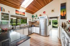  1 Debenham Road North Somersby NSW 2250 Sitting atop the beautiful Somersby Plateau and set back from the road, along a tree lined driveway, is this glorious 22 acre equine property with multiple lush paddocks and extensive horse facilities along with a gracious, warm and comfortable Australian country homestead. The property has two street access and there are DA approved plans for a separate dwelling and shed. The home exudes a light filled warmth and level of comfort that reflects the owners’ good taste and offers a spacious main bedroom with a beautifully renovated ensuite and walk in robe, two large additional bedrooms with built-ins, and a vast rumpus/4th bedroom with newly renovated bathroom facility and an office/study with northerly aspect near the main entrance. Huge main bathroom with separate bath and shower, toilet and double vanity area with direct access to the pool deck. The main bedroom suite and lounge flow on to the east facing covered verandah with beautiful views over the paddocks to the east. There are multiple living areas both internally and externally, high ceilings and a well-appointed swimming pool/spa complex. The home is air-conditioned and there is a feature open fire place in the lounge room area. The central living spaces are well connected with an open plan feel and enjoy great views of the many beautifully established gardens. A large main bathroom complex, oversize laundry and mud room complete the picture. Extensive solar panels are fitted and connected to a net meter for minimum power bills and there is solar hot water with mains back-up. Except for the two conservation corridors, the property is clear. Two dams are situated in these areas and receive both spring water and overland flow and are at the head waters of Narara Creek. Water supply is from both rain and bore water and is delivered to all 14 paddocks – 3 large and 11 smaller. There are currently 12 horses on the property in the electrified, well fenced paddocks with their own shelters. The property has carried as many as 22 horses. Water is available to all paddocks. Drainage across the entire acreage ensures ground water flows are directed away from open pasture areas. There are multiple sheds for workshops, machinery storage, feed and general use. A concrete half cricket pitch is available for endless hours of practice and fun! This is a unique property at a beautiful location, just around 5 minutes to the M1, 10 minutes to Kariong, 15 minutes to Gosford and about 30 minutes to Wahroonga. It is on the doorstop of all the great facilities the Central Coast now has to offer, including state of the art Hospitals, Schools, Shopping Centres – and of course NSW’s most beautiful beaches and waterways. There is currently a substantial income stream from agistment of paddocks to a race horse trainer. 